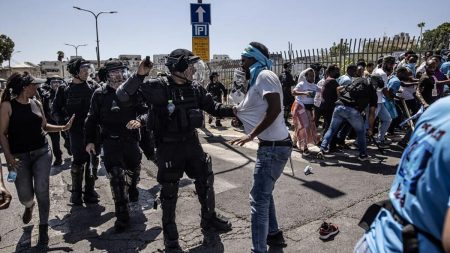 Eritrean asylum seekers clash with the Israeli police in Tel Aviv on September 2, 2023. (Photo by Mostafa Alkharouf/Anadolu Agency via Getty Images)