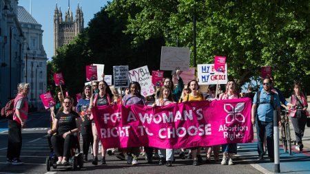 Pro-choice supporters march through central London to the US Embassy in a protest against the US Supreme Court's intention to overturn the 1973 Roe v Wade law, on May 14, 2022. (Photo by Wiktor Szymanowicz/Anadolu Agency via Getty Images)