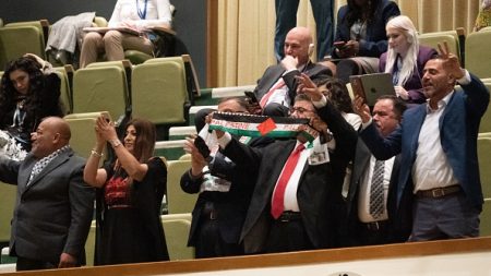 Supporters applaud as Palestinian president Mahmoud Abbas ends his address to the 77th session of the United Nations General Assembly at UN headquarters in New York on September 23, 2022. (Photo by Bryan Smith/AFP via Getty Images)