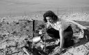 A woman waters a plant in the Negev Desert in Israel, 1950-1960. (Photo: Touring Club Italiano/Marka/Universal Images Group via Getty Images)